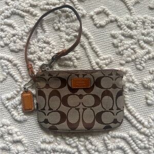 Coach brown wristlet. Used, in good condition.